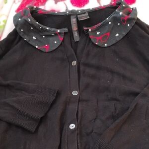 Retro Chic Black Sweater with Red and White Highlights